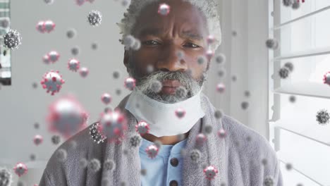 Animation-of-virus-cells-over-african-american-male-patient-with-face-mask