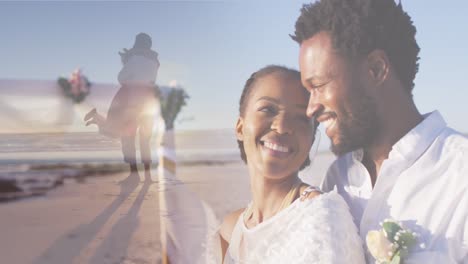 Animation-of-happy-african-american-couple-over-dancing-couple-on-beach