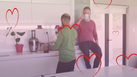 Animation-of-heart-icons-over-diverse-gay-couple-drinking-coffee