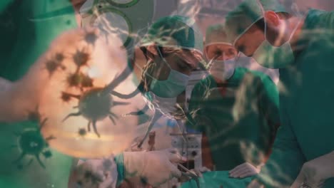 Animation-Von-Covid-19-Zellen-über-Verschiedenen-Chirurgen,-Die-Gesichtsmasken-Im-Operationssaal-Tragen