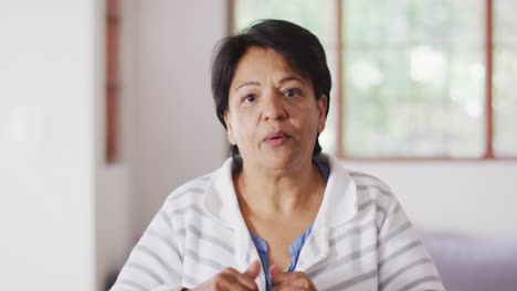 Portrait-of-asian-senior-woman-talking-looking-at-the-camera-at-home