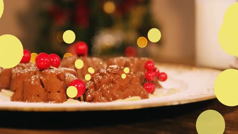 Animation-of-yellow-dots-moving-over-christmas-cake