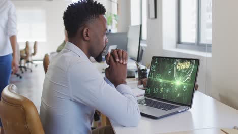 Video-of-african-american-man-working-on-laptop-with-crypto-money-on-screen