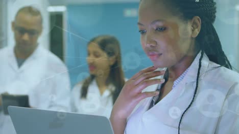 Animation-of-scientific-data-over-afrcian-american-female-lab-worker-using-tablet