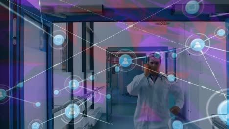 Animation-of-network-of-connections-over-male-doctor-walking-on-corridor