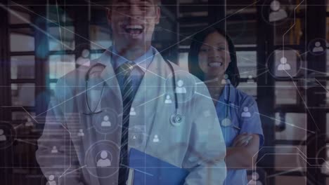 Animation-of-network-of-connections-over-happy-diverse-female-and-male-doctors
