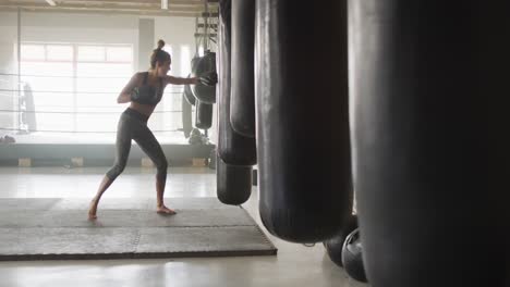 Video-of-fit-caucasian-woman-boxing-at-gym