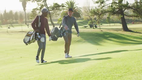 Video-of-diverse-male-friends-walking-on-golf-field