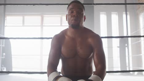 Video-of-fit-and-tired-african-american-man-after-boxing-training-at-gym