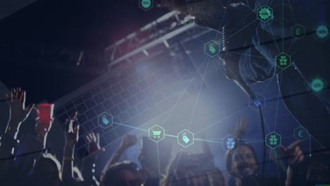 Animation-of-connections-of-hexagons-with-icons-over-hands-of-diverse-people-on-concert