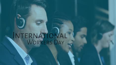 Animation-of-international-workers-day-over-diverse-male-and-female-consultantss-at-work
