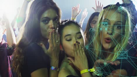 Animation-of-connections-with-icons-over-biracial-women-sending-kisses-at-concert