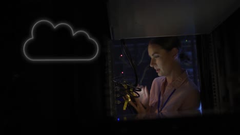 Animation-of-cloud-over-caucasian-woman-working-in-server-room
