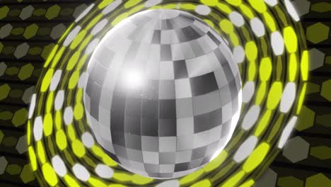 Animation-of-disco-mirror-ball-spinning-over-silver-and-yellow-glowing-discs