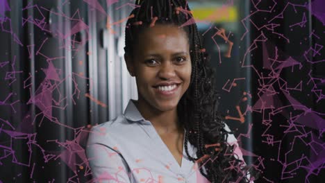 Animation-of-connections-over-happy-african-american-woman-posing-in-server-room
