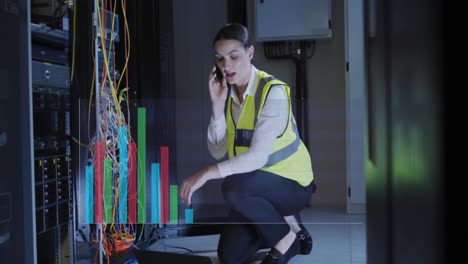 Animation-of-graphs-over-caucasisn-woman-working-in-server-room