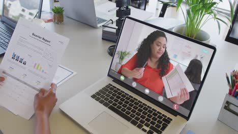 African-american-businesswoman-using-laptop-for-video-call-with-biracial-business-colleague
