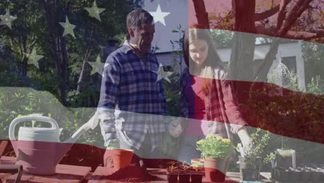 Animation-of-american-flag-over-caucasian-father-and-daughter-gardening