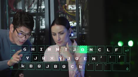 Animation-of-binary-code-over-diverse-man-and-woman-working-on-laptop-in-server-room