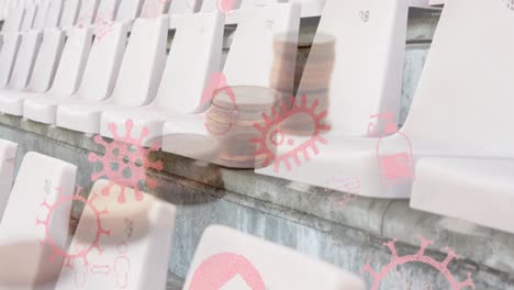 Animation-of-virus-icons-over-coins-and-stadium-chairs