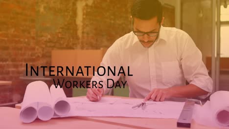 Animation-of-international-workers-day-over-caucasian-male-engineer