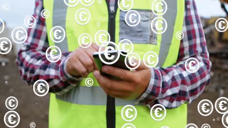 Animation-of-euro-icons-blinking-over-hands-of-caucasian-male-worker-using-smartphone