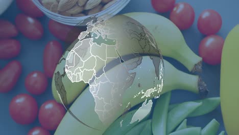 Animation-Des-Globus-über-Auf-Dem-Tisch-Liegenden-Früchten-Und-Gemüse
