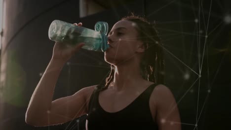 Animation-of-network-of-connections-over-fit-biracial-woman-drinking-water