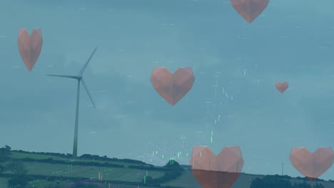 Animation-Von-Herzen,-Die-Mit-Einer-Windkraftanlage-über-Eine-Landschaft-Fallen
