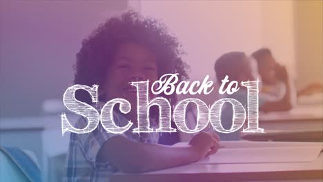 Animation-of-back-to-school-over-happy-african-american-girl-sitting-in-school-desk