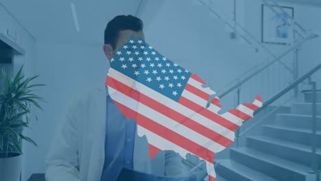 Animation-of-usa-map-with-flag-over-caucasian-female-and-male-doctors-talking-on-corridor