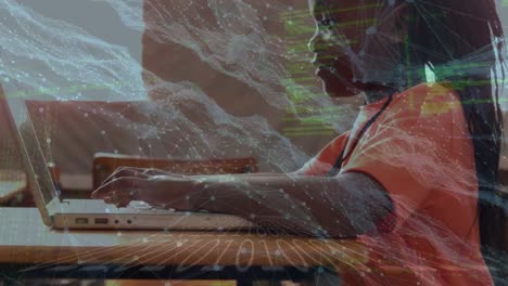 Animation-of-data-processing-and-waves-over-african-american-girl-using-laptop-at-school