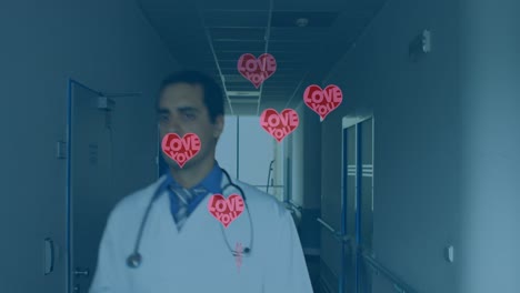 Animation-of-hearts-with-love-over-caucasian-doctor-walking-on-corridor