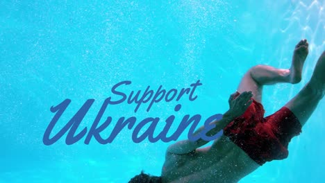 Animation-of-support-ukraine-over-caucasian-male-swimmer-diving