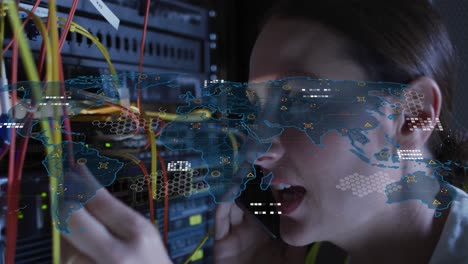 Animation-of-data-processing,-circuit-board-over-caucasian-female-it-technician-by-computer-server