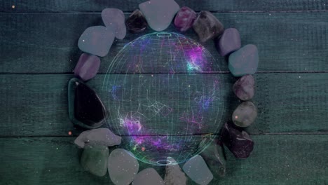 Animation-of-globe-and-shapes-over-colourful-stones