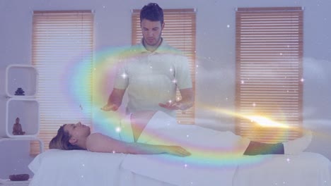 Animation-of-stars-and-galaxy-moving-over-caucasian-man-doing-massage-to-female-customer