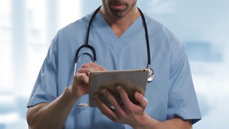 Animation-of-caucasian-male-doctor-using-tablet-over-hospital