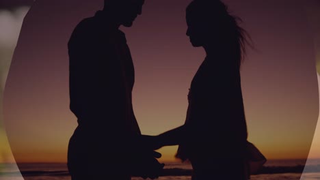 Animation-of-couple-embracing-over-sunset