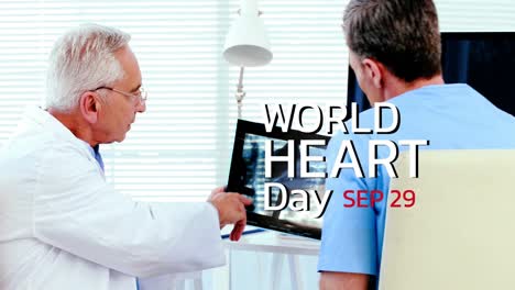 Animation-of-world-heart-day-text-over-caucasian-male-doctor-and-patient
