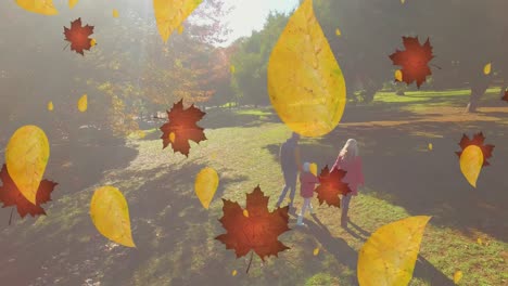 Animation-of-leaves-falling-over-caucasian-family-in-park