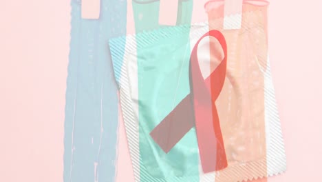 Animation-of-red-ribbon-over-colorful-condoms