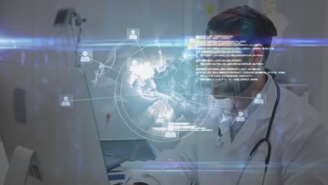 Spinning-globe-and-data-processing-over-portrait-of-caucasian-male-doctor-using-computer-at-hospital
