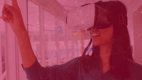 Animation-of-network-of-connections-over-caucasian-businesswoman-using-vr-headset