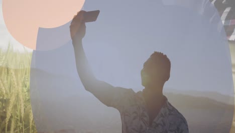 Animation-of-frame-over-happy-african-american-man-taking-selfie