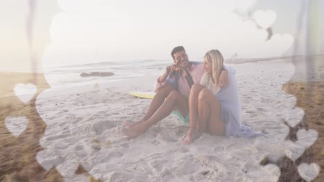 Animation-of-white-banner-with-copy-space-over-caucasian-couple-enjoying-beer-at-the-beach