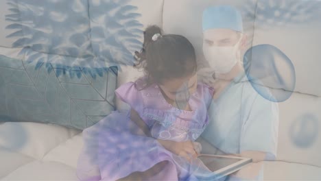 Animation-of-virus-cells-over-sick-biracial-girl-with-table-and-caucasian-male-surgeon