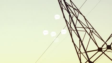 Animation-of-speech-bubbles-over-electricity-poles-at-sunset