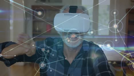 Animation-of-data-processing-over-caucasian-man-using-vr-headset