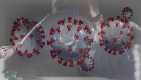 Animation-Von-Viruszellen-über-Einem-Kaukasischen-Männlichen-Arzt-Mit-Reagenzglas